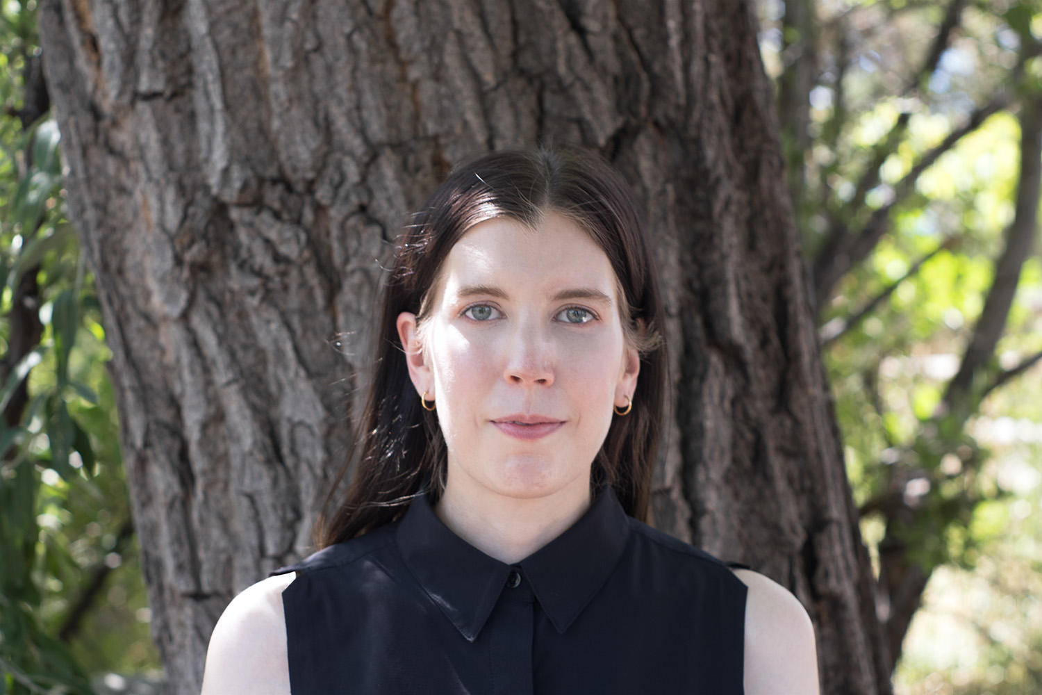 marketing manager Alison Wermuth smiling in front of a tree